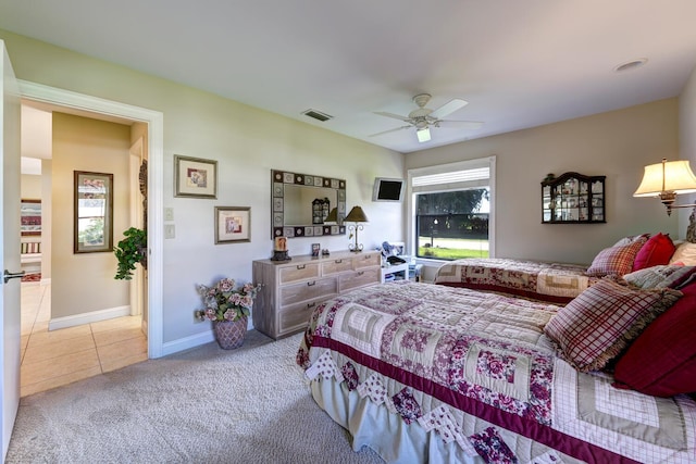 bedroom with ceiling fan and light colored carpet