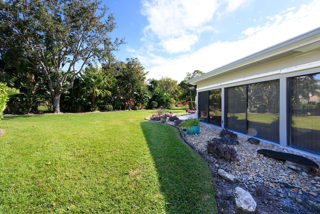 view of yard featuring a sunroom