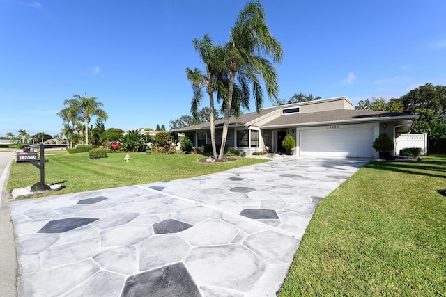 single story home featuring a front yard and a garage