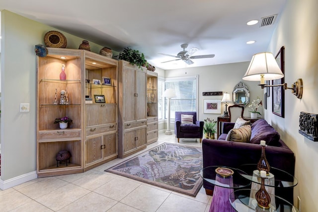 living room featuring ceiling fan and light tile patterned floors