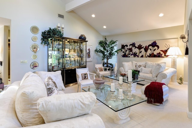 living room with lofted ceiling with beams and carpet flooring