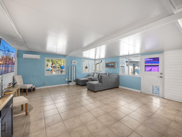 living room with a wall mounted AC, light tile patterned flooring, and vaulted ceiling