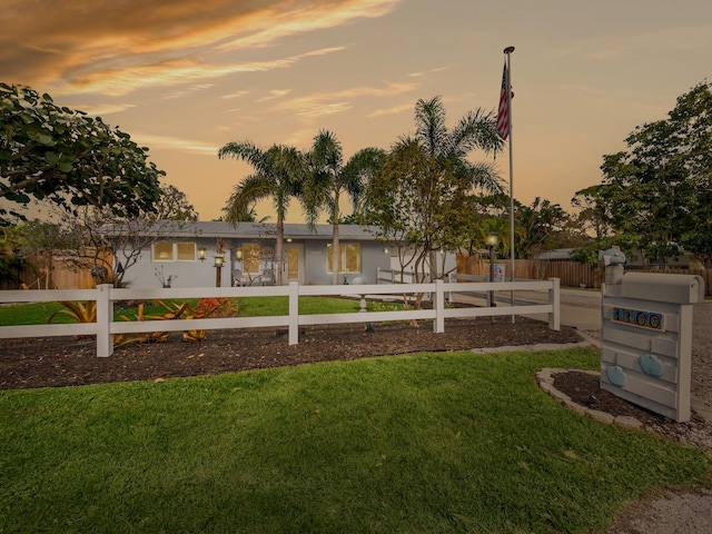 view of yard at dusk