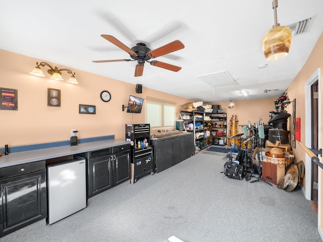 bar with pendant lighting, ceiling fan, light colored carpet, and fridge