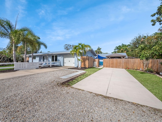 ranch-style house featuring a garage