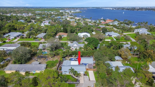 birds eye view of property with a water view