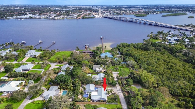 birds eye view of property with a water view