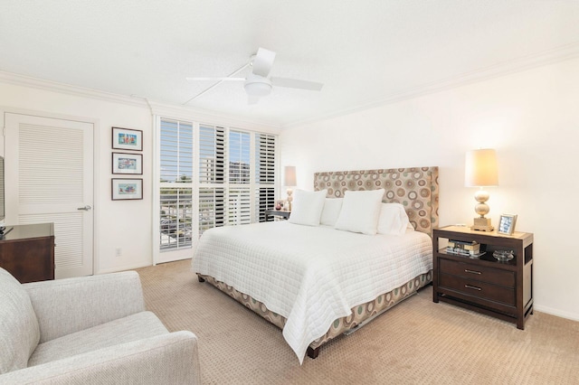 carpeted bedroom with crown molding and ceiling fan