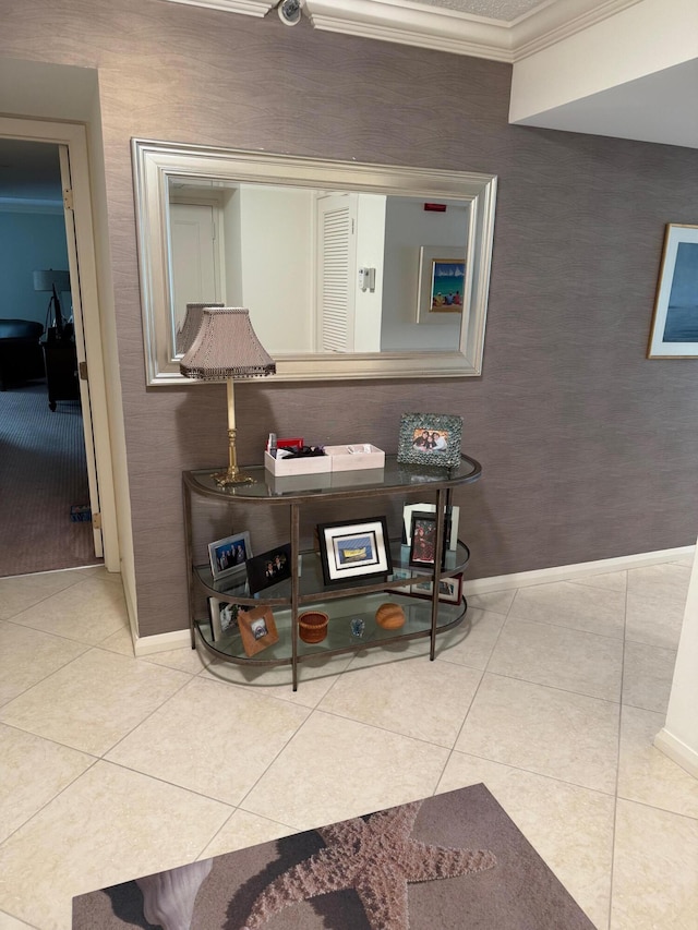 interior space with tile patterned flooring and crown molding