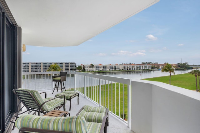 balcony featuring a water view