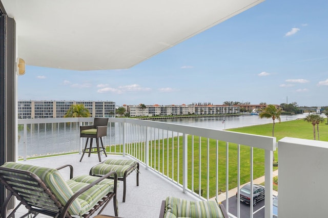 balcony featuring a water view