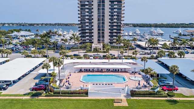 birds eye view of property with a water view