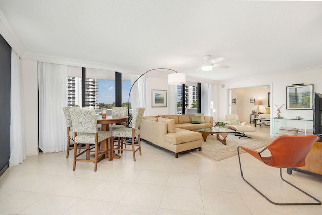 living room with crown molding, ceiling fan, and light tile patterned flooring