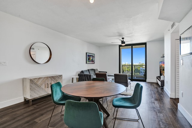 dining space with ceiling fan, floor to ceiling windows, and dark wood-type flooring