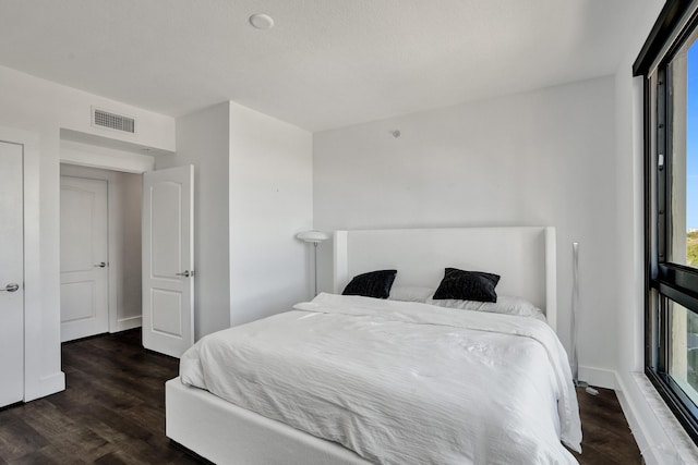 bedroom featuring dark hardwood / wood-style floors