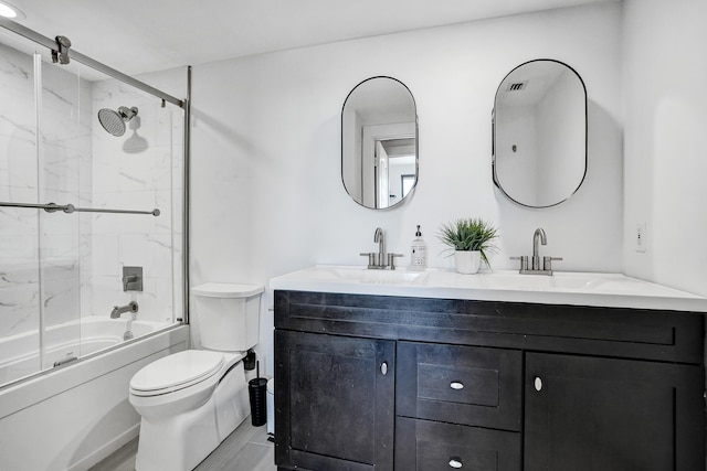 full bathroom featuring vanity, enclosed tub / shower combo, and toilet