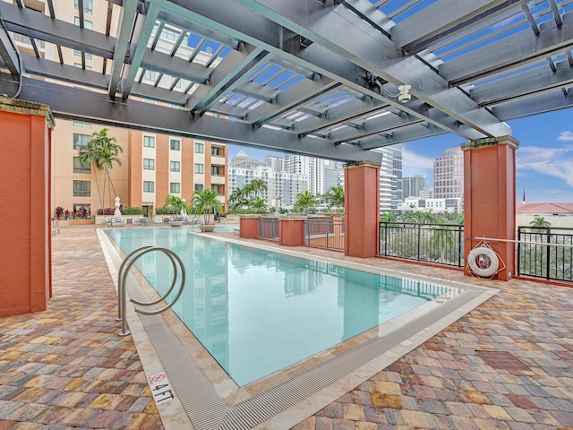 view of swimming pool with a pergola