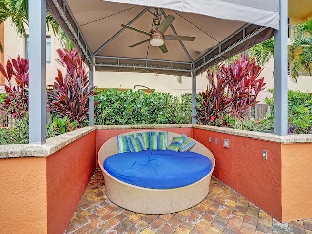 view of patio / terrace featuring a gazebo and ceiling fan