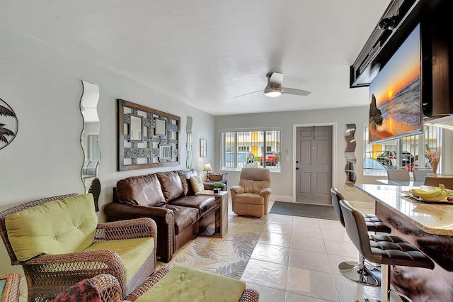 tiled living room with ceiling fan