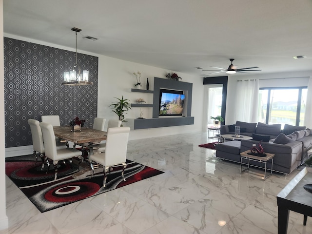 living area with visible vents, marble finish floor, an accent wall, and wallpapered walls