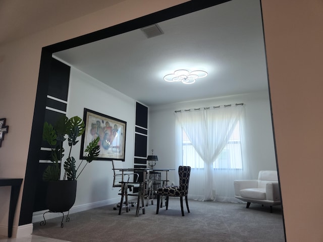 dining area featuring baseboards, visible vents, and carpet floors