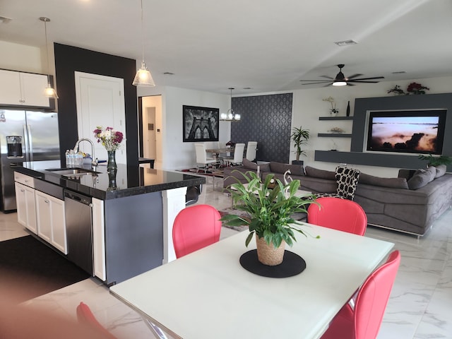 dining space with visible vents, marble finish floor, and ceiling fan