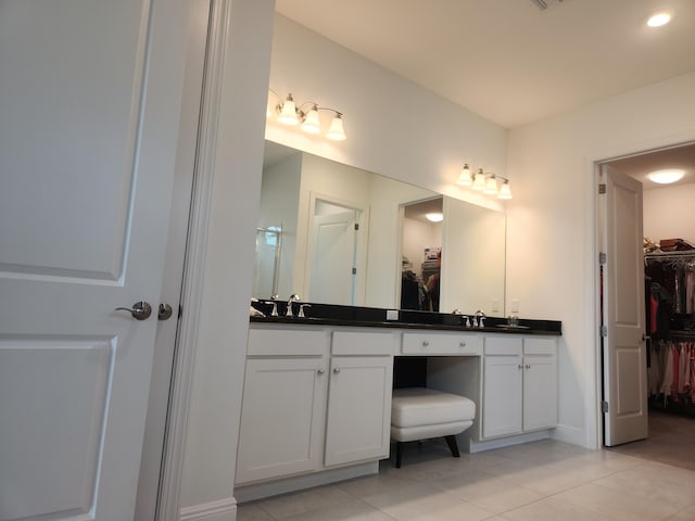 bathroom with vanity and tile patterned flooring