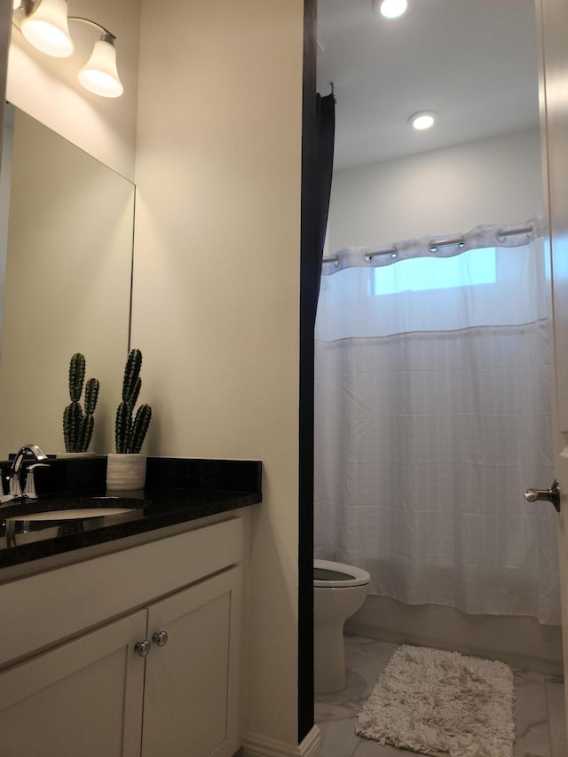 bathroom featuring vanity, recessed lighting, shower / bath combo, toilet, and marble finish floor