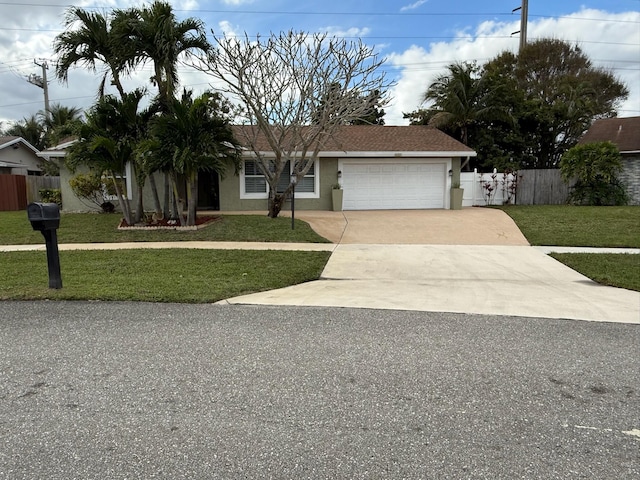 view of front facade with a garage and a front lawn