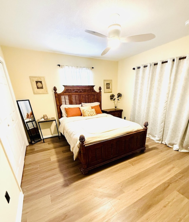 bedroom featuring ceiling fan and light wood-type flooring