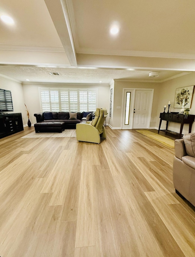 living room with hardwood / wood-style flooring and ornamental molding