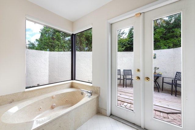 bathroom featuring a bath and french doors