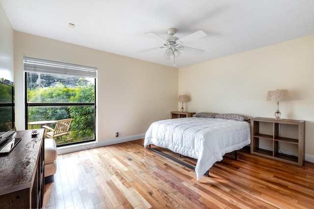 bedroom with light hardwood / wood-style floors and ceiling fan