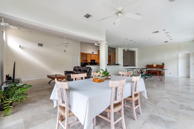 dining space featuring ornate columns