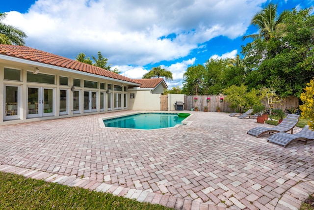 view of swimming pool featuring a patio area