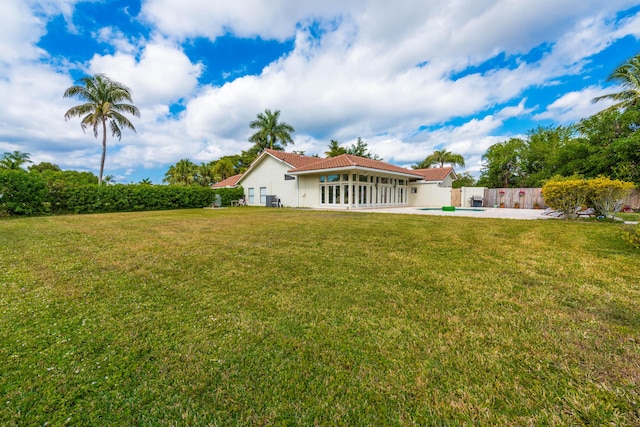 view of yard with a fenced in pool and a patio