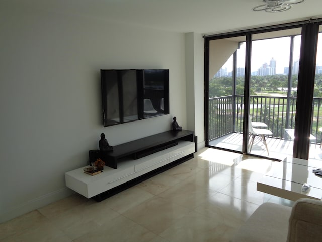 living room with floor to ceiling windows