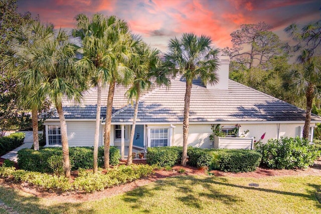 view of front of house with a yard