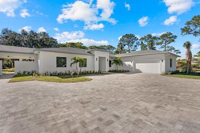 view of front of house featuring a front yard and a garage