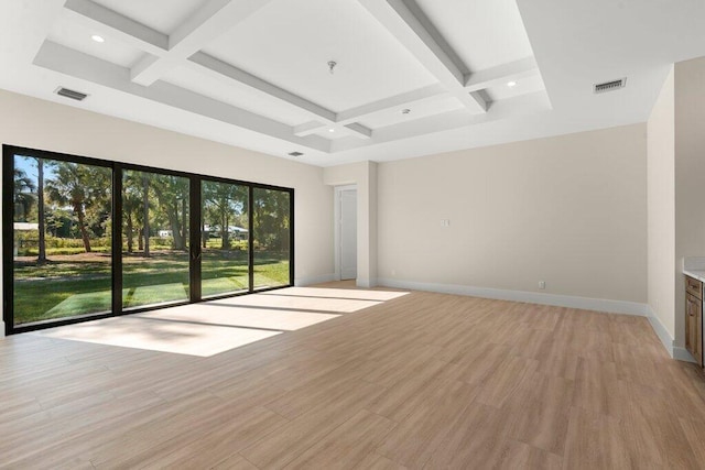 interior space with beam ceiling, coffered ceiling, and light hardwood / wood-style flooring