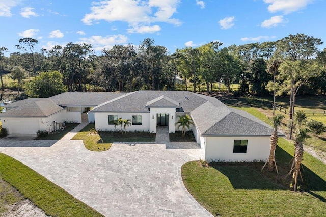 view of front facade with a garage and a front yard