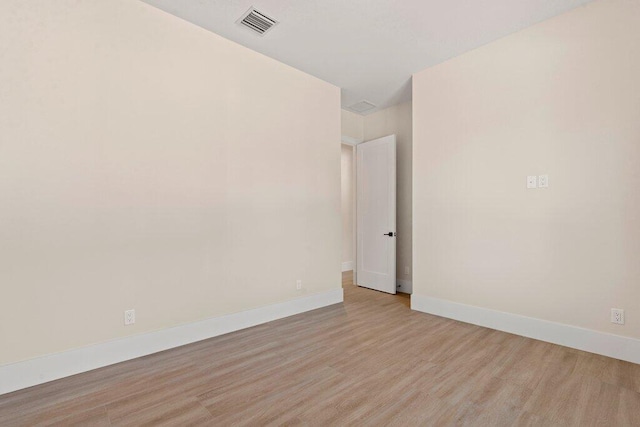 unfurnished room with light hardwood / wood-style flooring