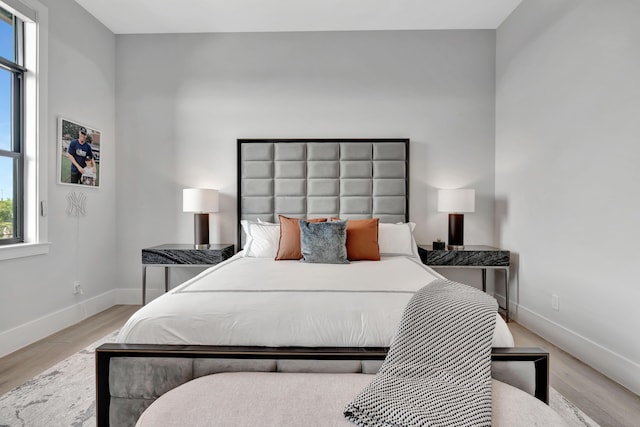 bedroom with light hardwood / wood-style floors