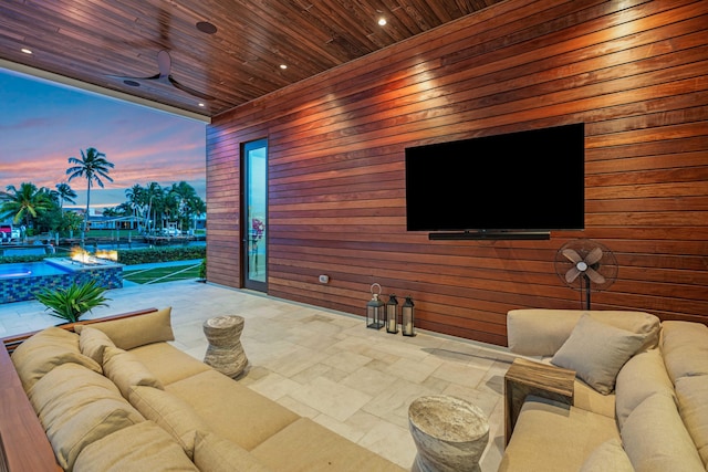 view of patio / terrace featuring ceiling fan and an outdoor living space