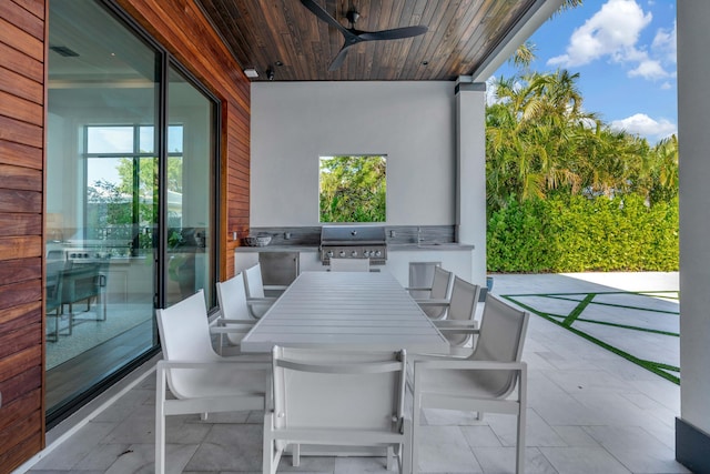 view of patio / terrace featuring ceiling fan, exterior kitchen, and grilling area