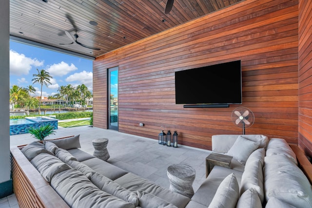 view of patio / terrace with ceiling fan and outdoor lounge area