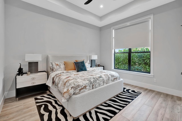 bedroom featuring ceiling fan and light hardwood / wood-style flooring