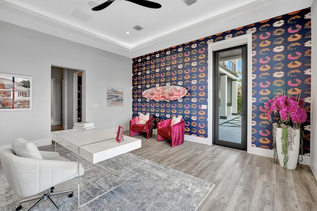 office with ceiling fan and light hardwood / wood-style flooring