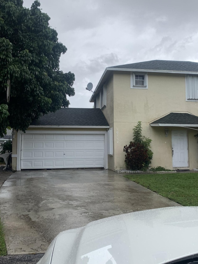 view of side of home featuring a garage