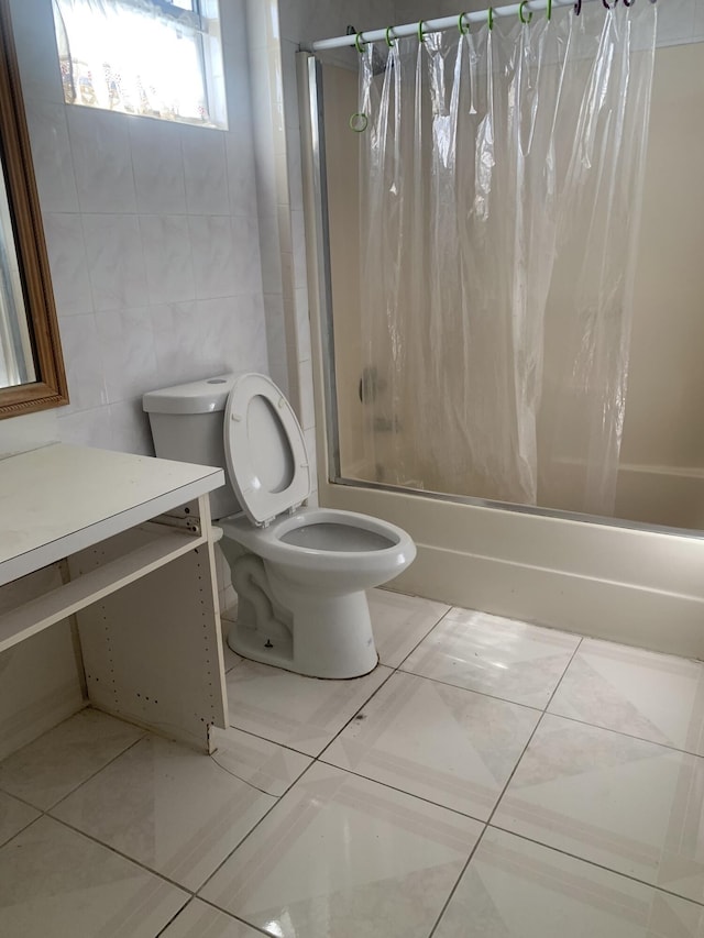 full bathroom featuring shower / bath combo, tile walls, tile patterned flooring, vanity, and toilet